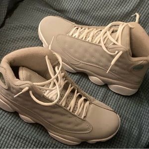 Grey men’s Jordan 13 sneakers.